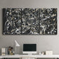 Three-panel canvas wall art featuring energetic expressionist abstract splatter, displayed above a desk in a home office.