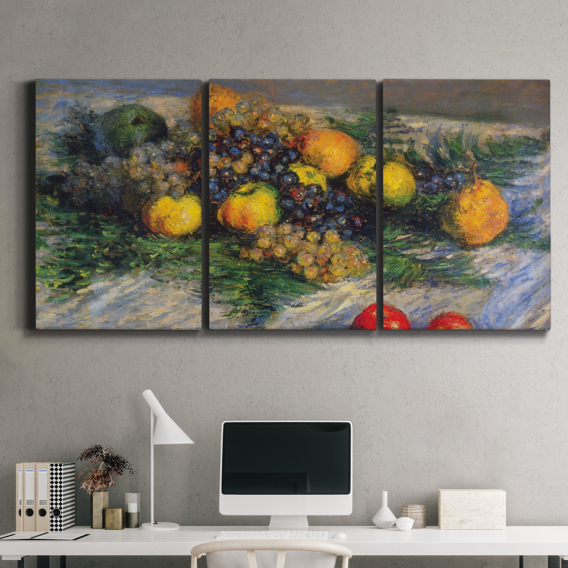 Three-panel canvas wall art featuring still life with pears and grapes, displayed above a desk in a home office.