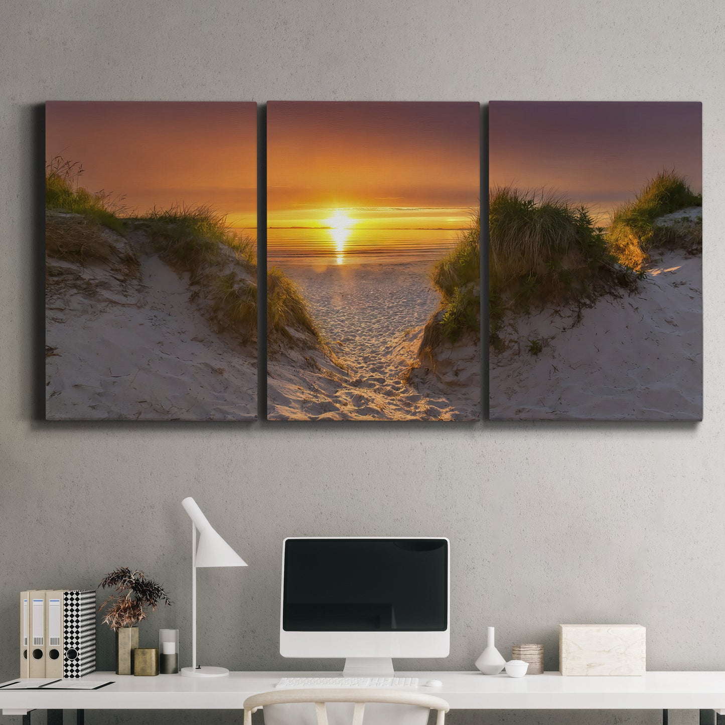 Three-panel canvas wall art featuring sunlit tropical path through greenery, displayed above a desk in a home office.