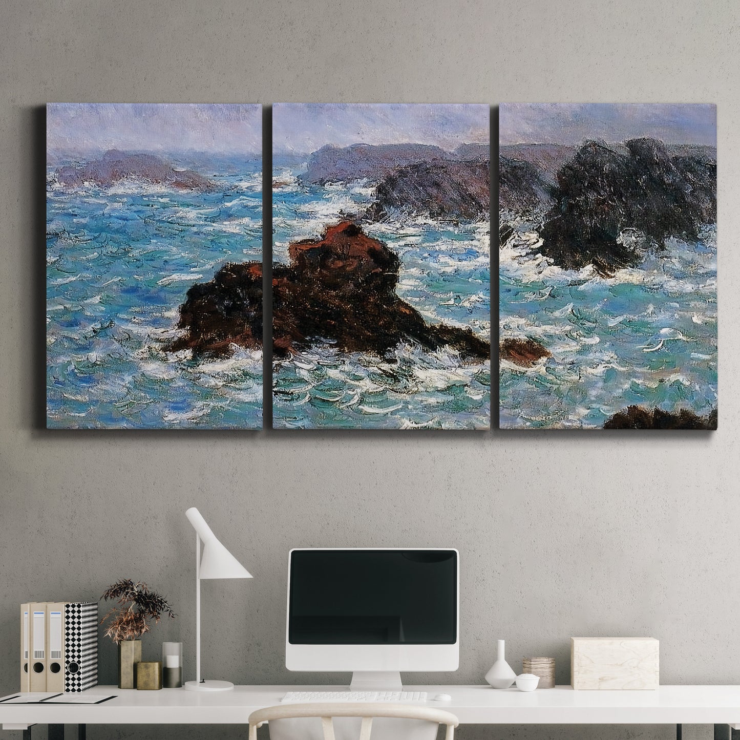 Three-panel canvas wall art featuring storm waves battering rocky coast, displayed above a desk in a home office.