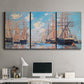 Three-panel canvas wall art featuring harbor with boats and water, displayed above a desk in a home office.
