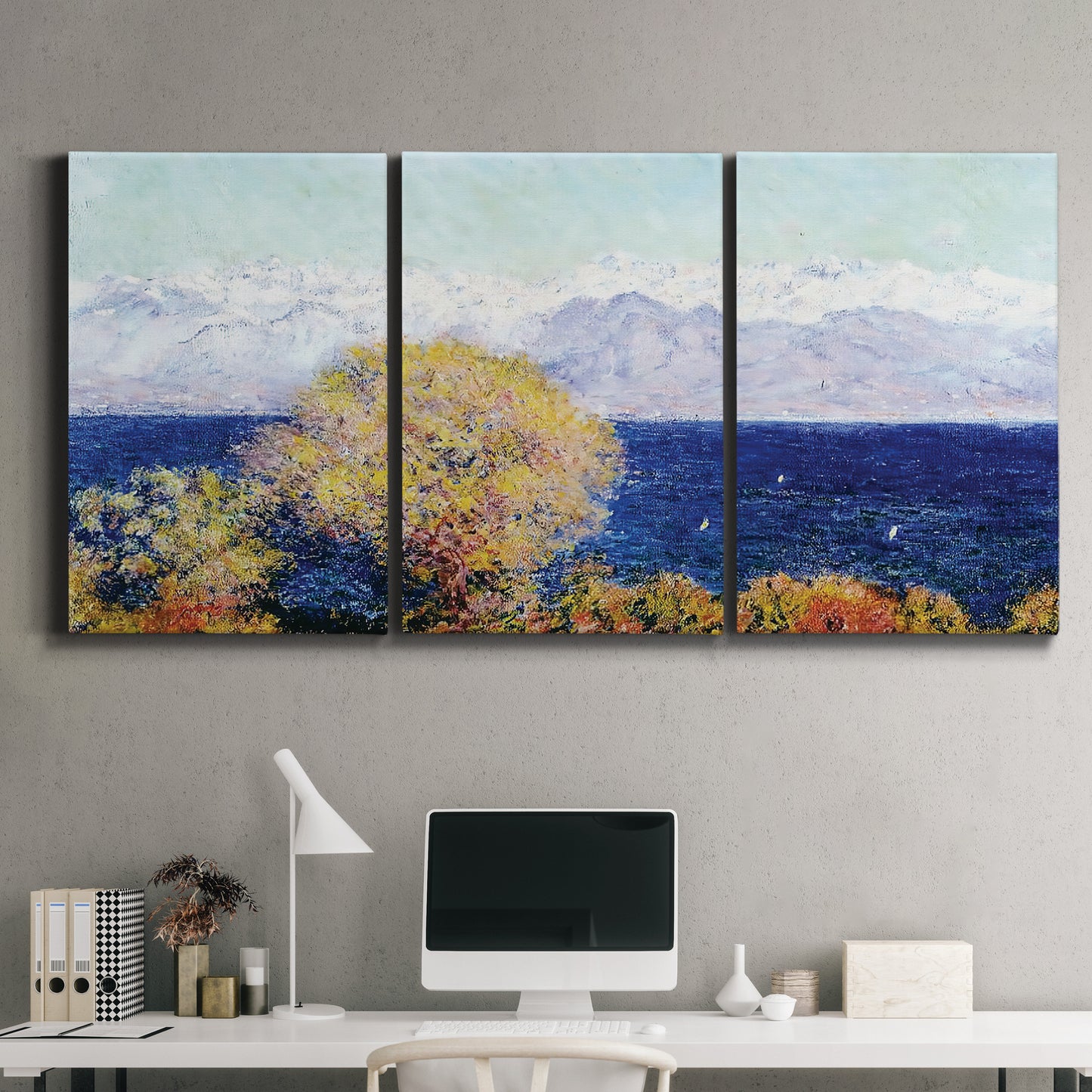 Three-panel canvas wall art featuring mediterranean coastline with headland, displayed above a desk in a home office.