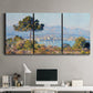 Three-panel canvas wall art featuring coastal town viewed from hillside, displayed above a desk in a home office.