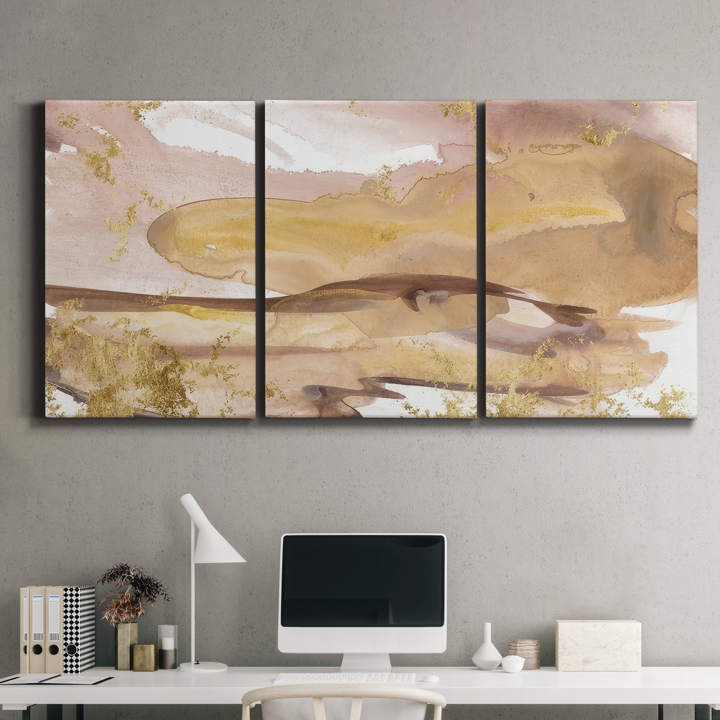 Three-panel canvas wall art featuring layered abstract dawn tones, displayed above a desk in a home office.