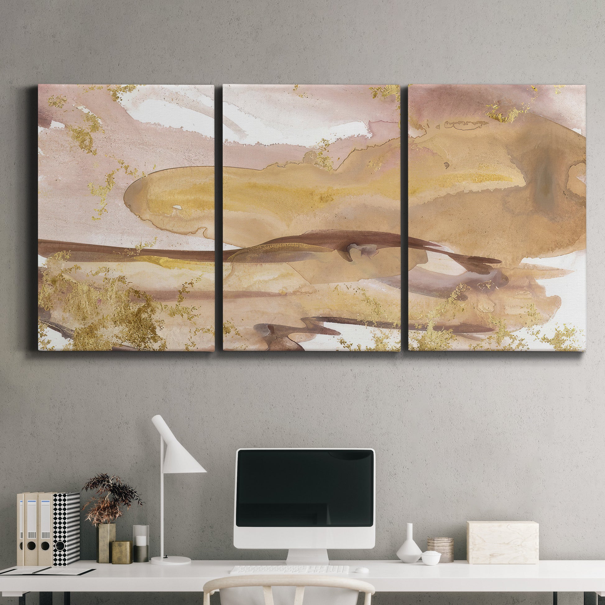 Three-panel canvas wall art featuring layered abstract dawn tones, displayed above a desk in a home office.