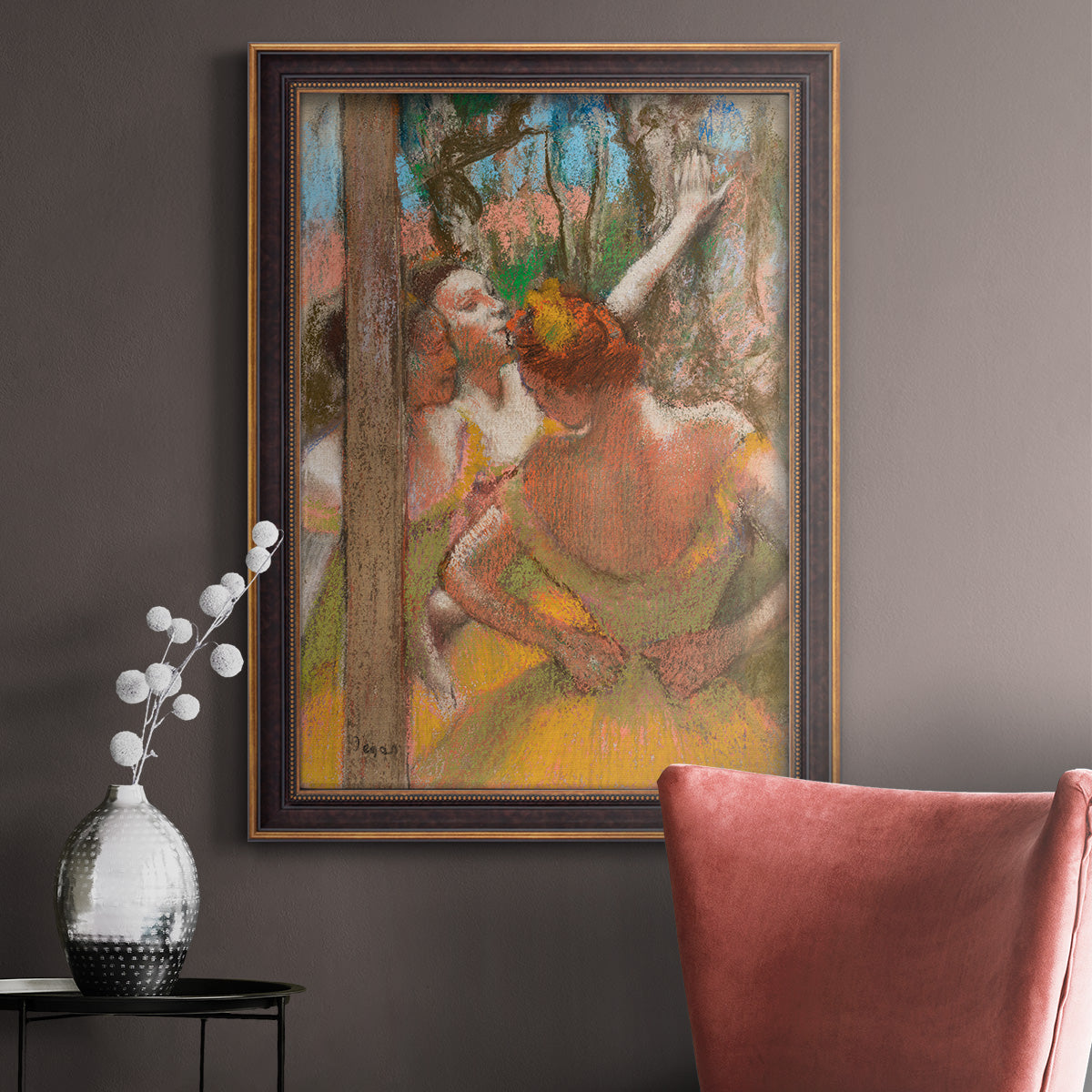 Impressionist ballet dancer composition by Edgar Degas in an ornate bronzed mahogany wood frame displayed in a neutral interior setting.