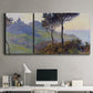 Three-panel canvas wall art featuring village church at sunset, displayed above a desk in a home office.