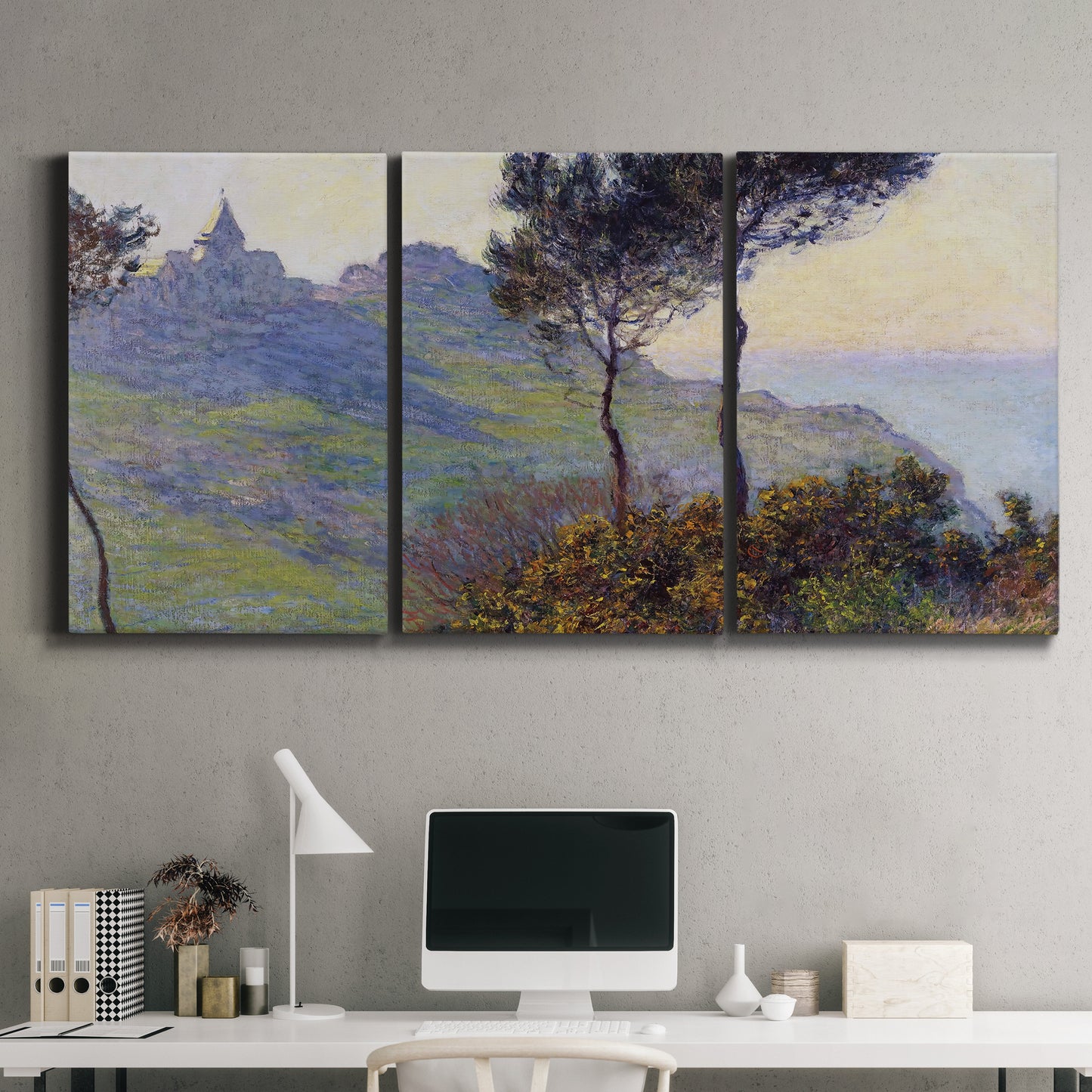 Three-panel canvas wall art featuring village church at sunset, displayed above a desk in a home office.
