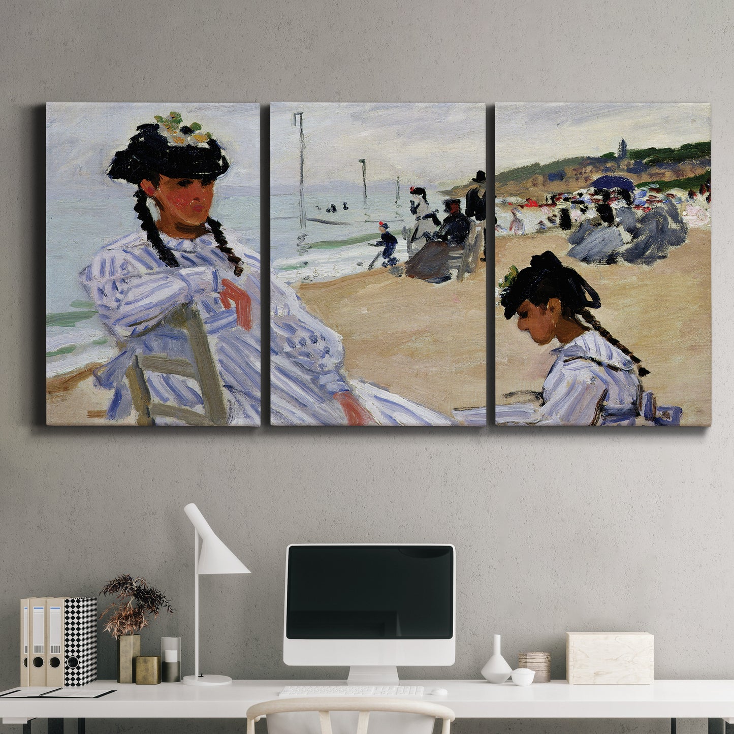 Three-panel canvas wall art featuring figures walking along sandy beach, displayed above a desk in a home office.