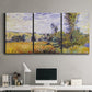 Three-panel canvas wall art featuring river village landscape with hills, displayed above a desk in a home office.