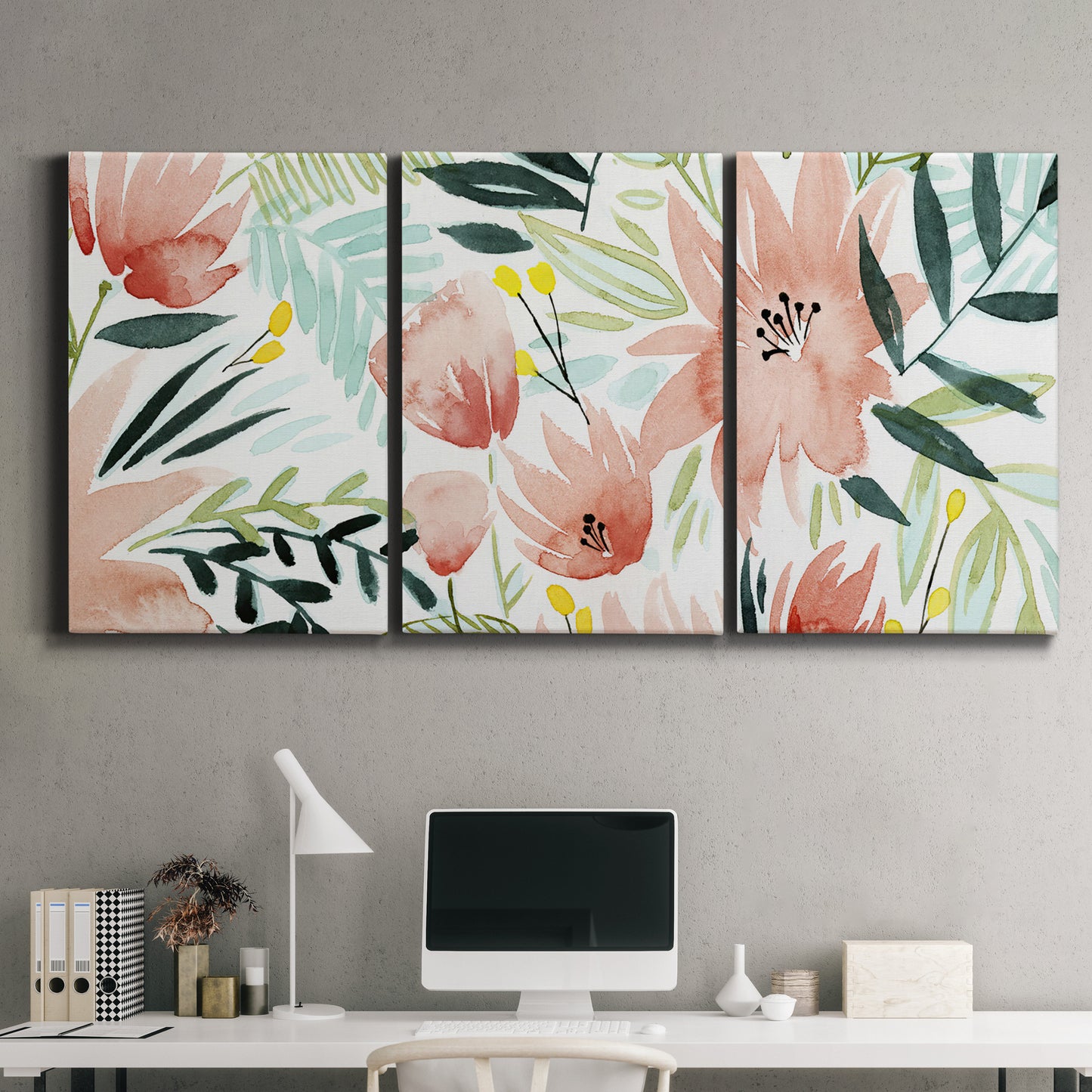 Three-panel canvas wall art featuring layered tropical plant collage, displayed above a desk in a home office.