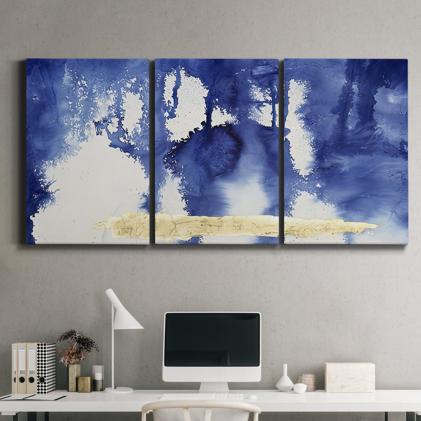 Three-panel canvas wall art featuring saturated abstract color fields, displayed above a desk in a home office.