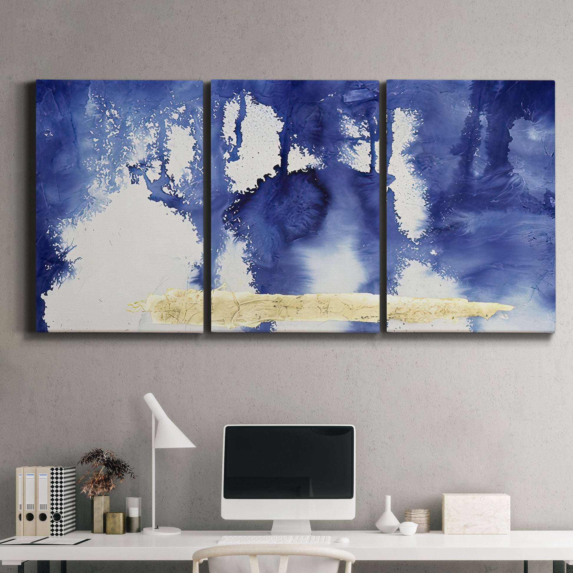 Three-panel canvas wall art featuring saturated abstract color fields, displayed above a desk in a home office.