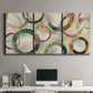 Three-panel canvas wall art featuring geometric circular abstract design, displayed above a desk in a home office.