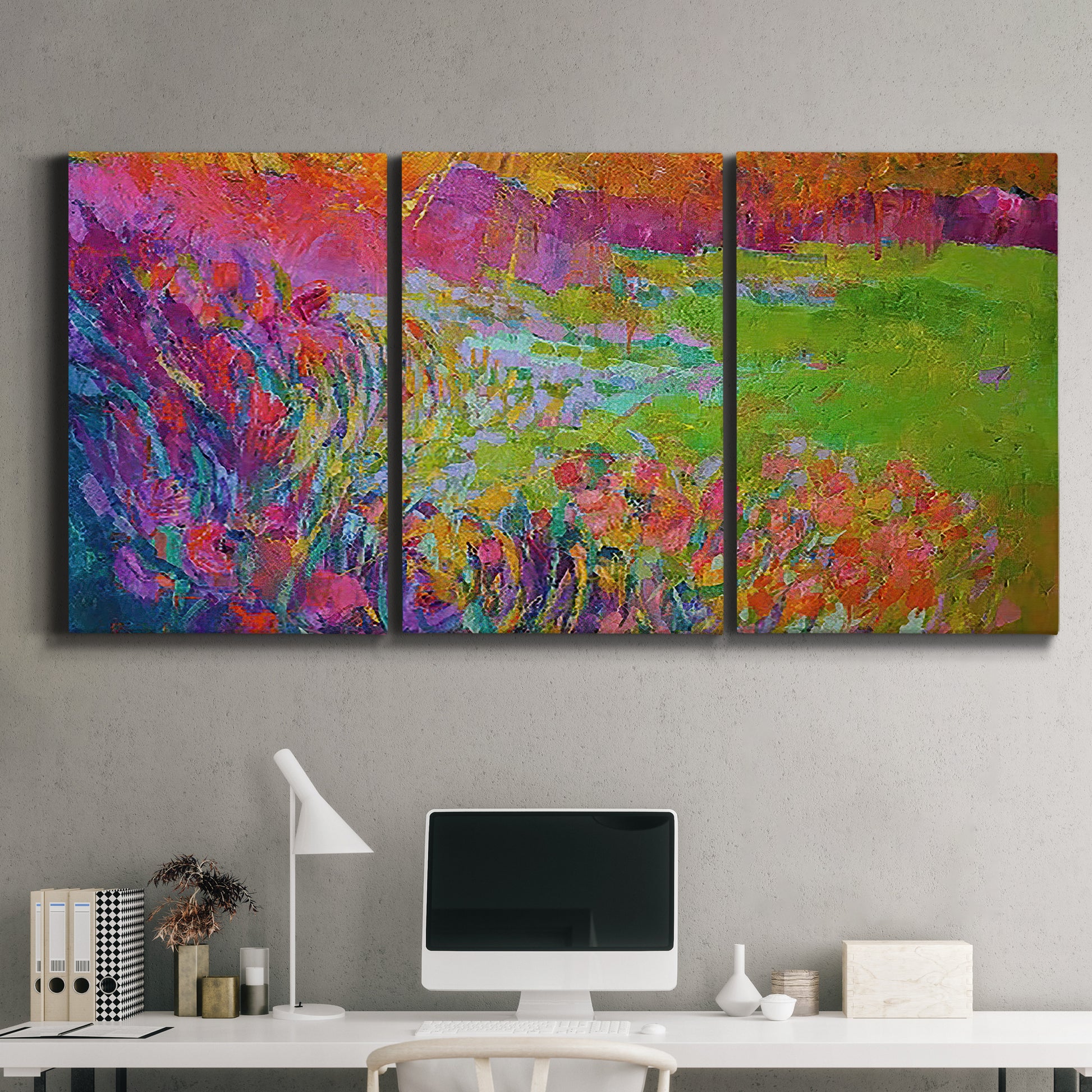 Three-panel canvas wall art featuring abstract meadow inspired color fields, displayed above a desk in a home office.