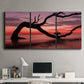 Three-panel canvas wall art featuring sunset beach photography, displayed above a desk in a home office.