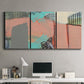Three-panel canvas wall art featuring layered mid century abstract pathways, displayed above a desk in a home office.