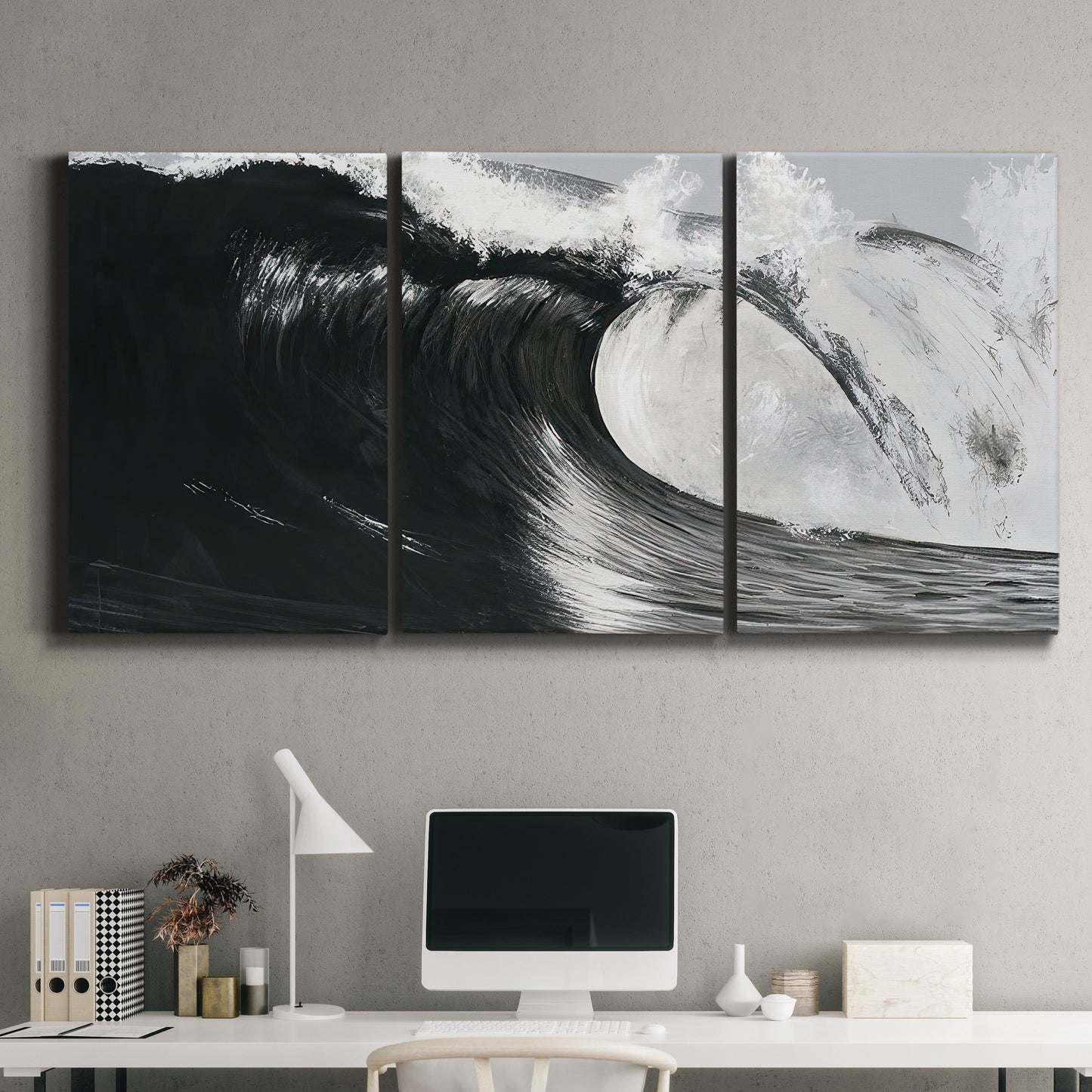 Three-panel canvas wall art featuring black and white crashing ocean waves, displayed above a desk in a home office.