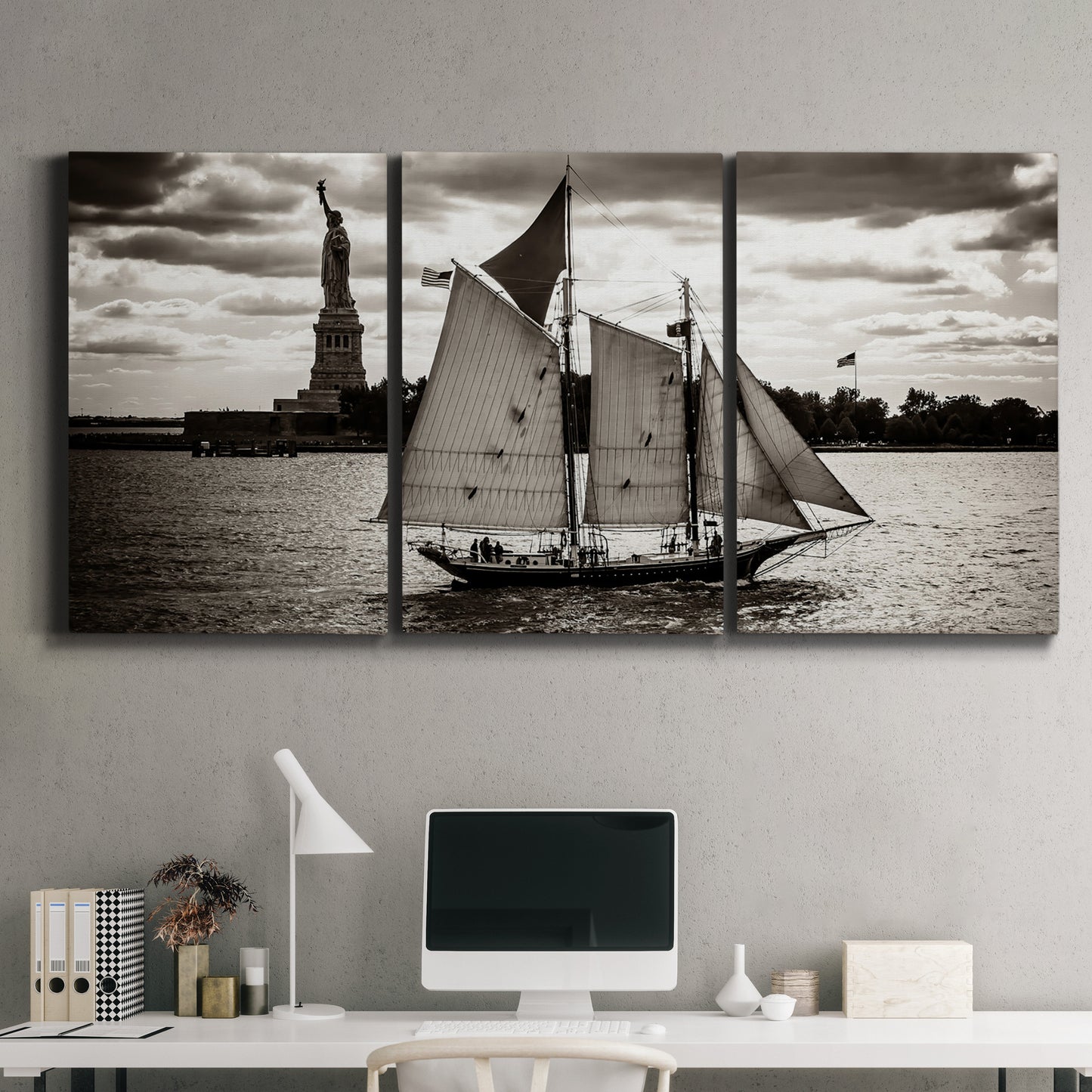 Three-panel canvas wall art featuring historic sailing ships photograph, displayed above a desk in a home office.