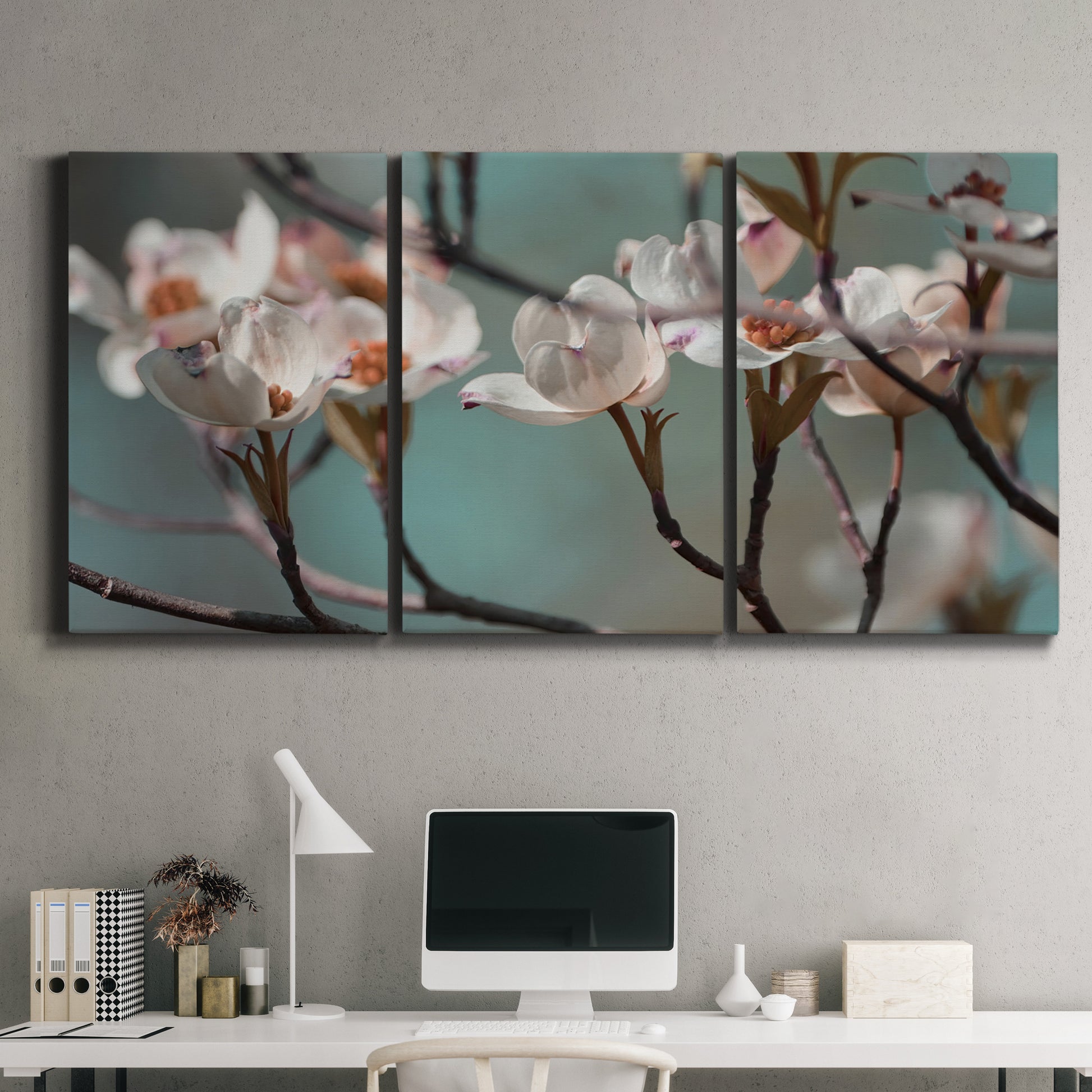 Three-panel canvas wall art featuring dogwood blossoms in spring photograph, displayed above a desk in a home office.