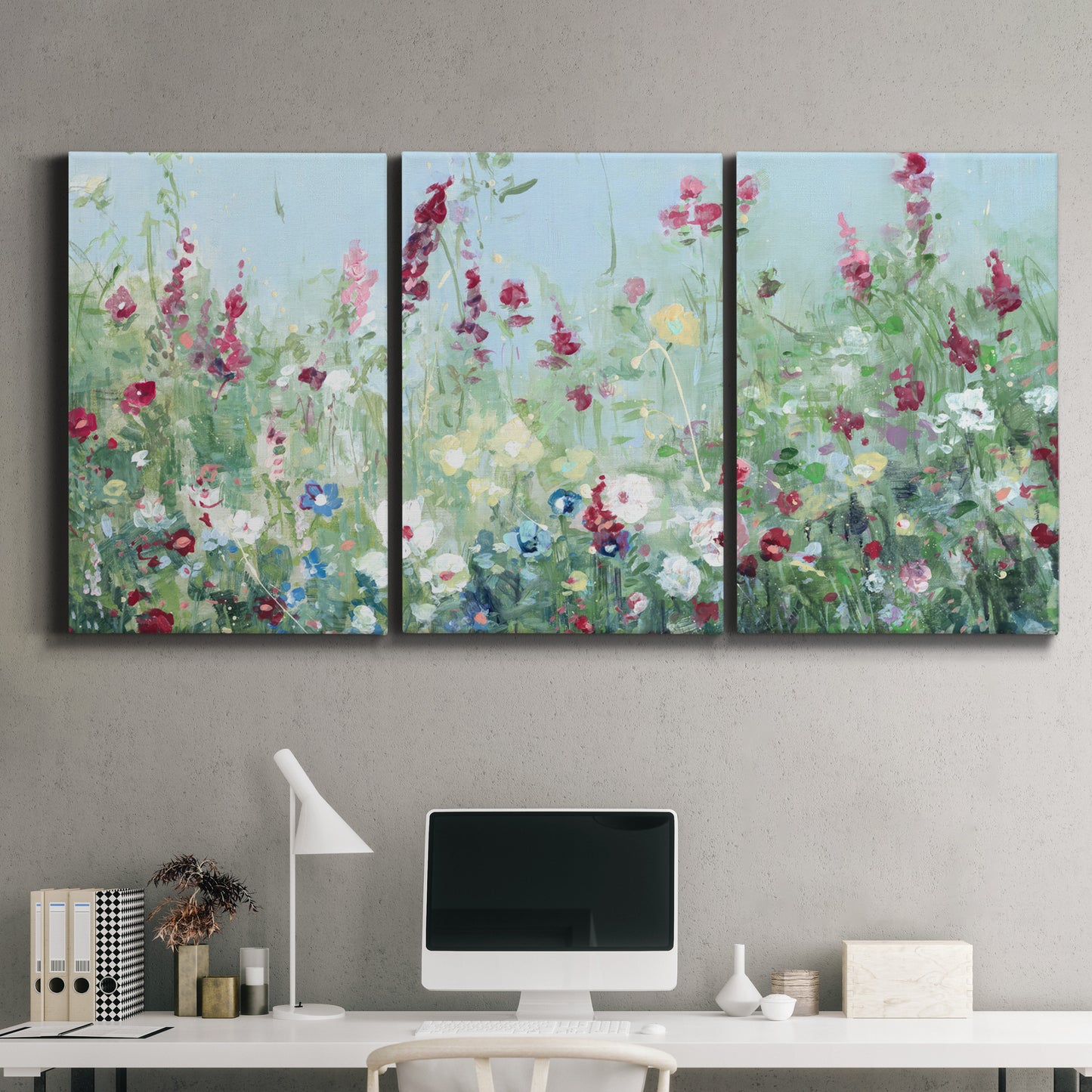 Three-panel canvas wall art featuring night landscape silhouette photography, displayed above a desk in a home office.