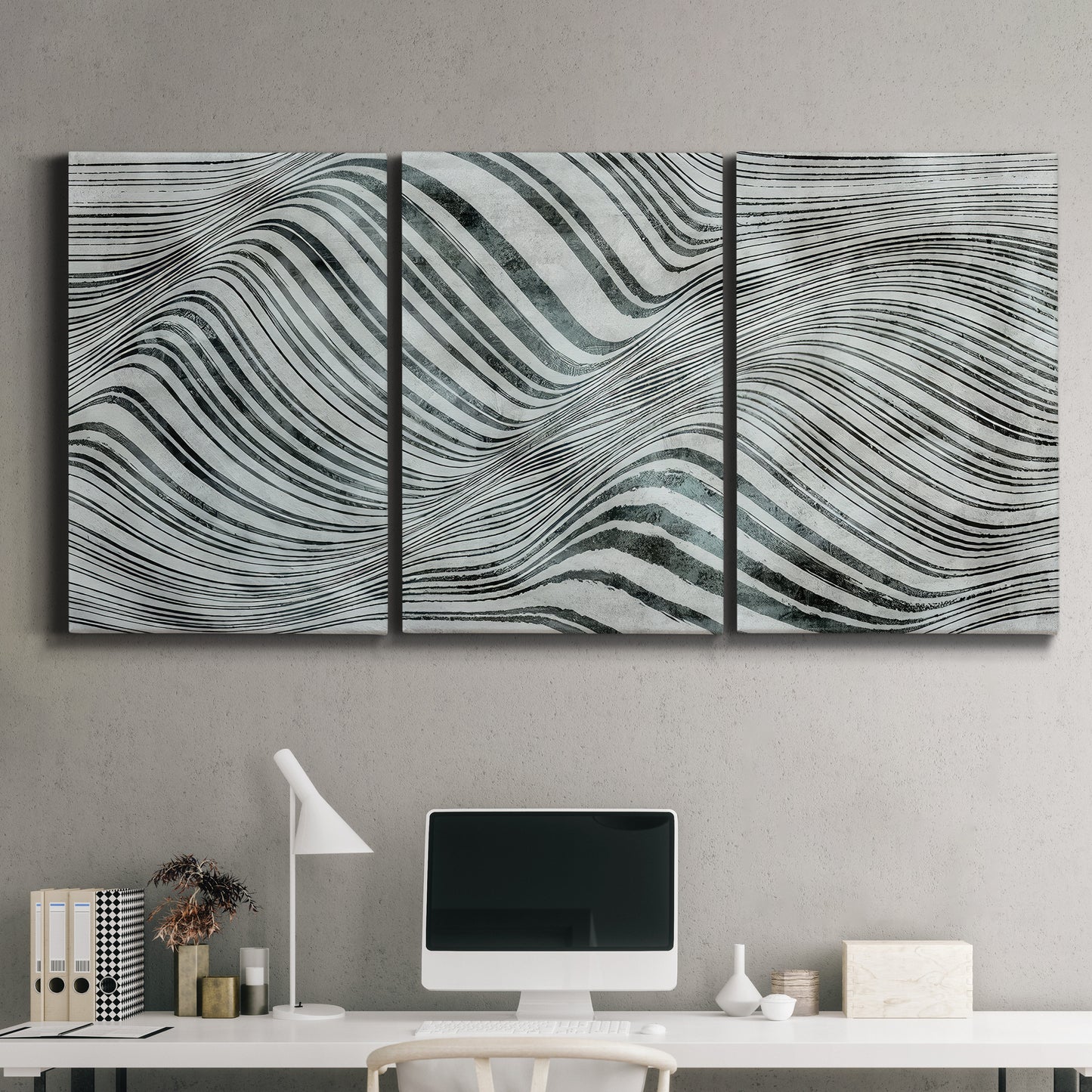Three-panel canvas wall art featuring coastal shoreline with gentle surf, displayed above a desk in a home office.