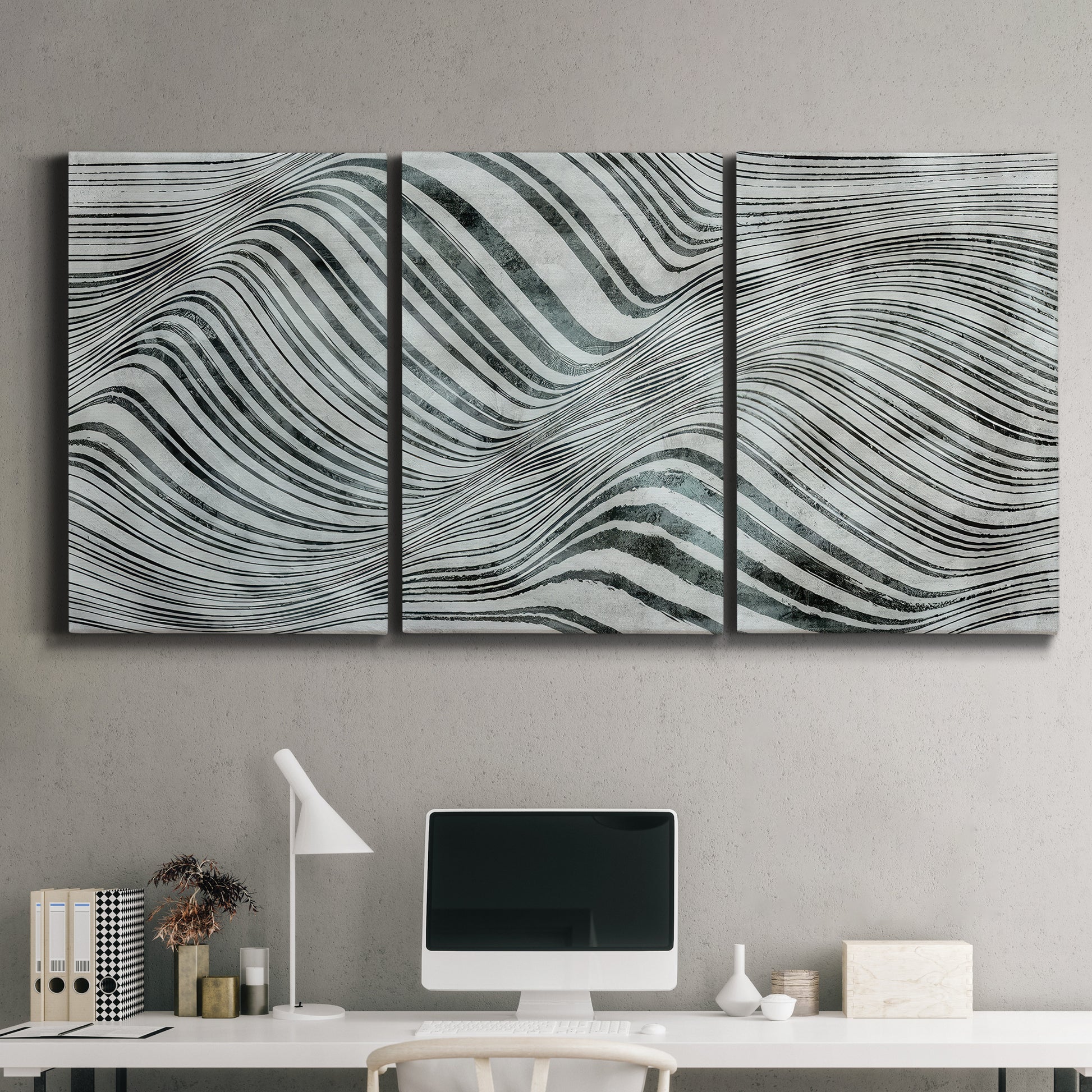 Three-panel canvas wall art featuring coastal shoreline with gentle surf, displayed above a desk in a home office.