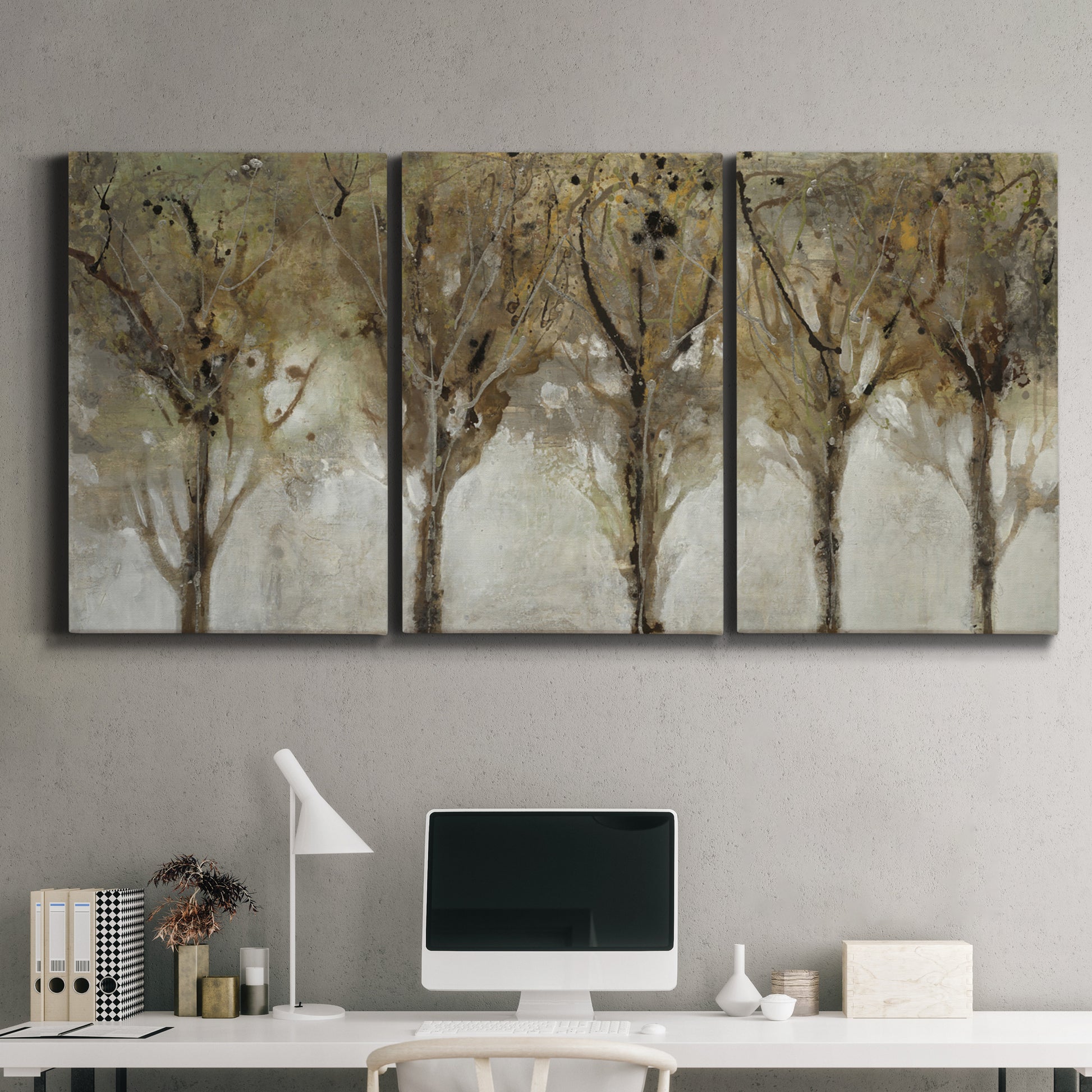 Three-panel canvas wall art featuring sunlight filtering through trees, displayed above a desk in a home office.