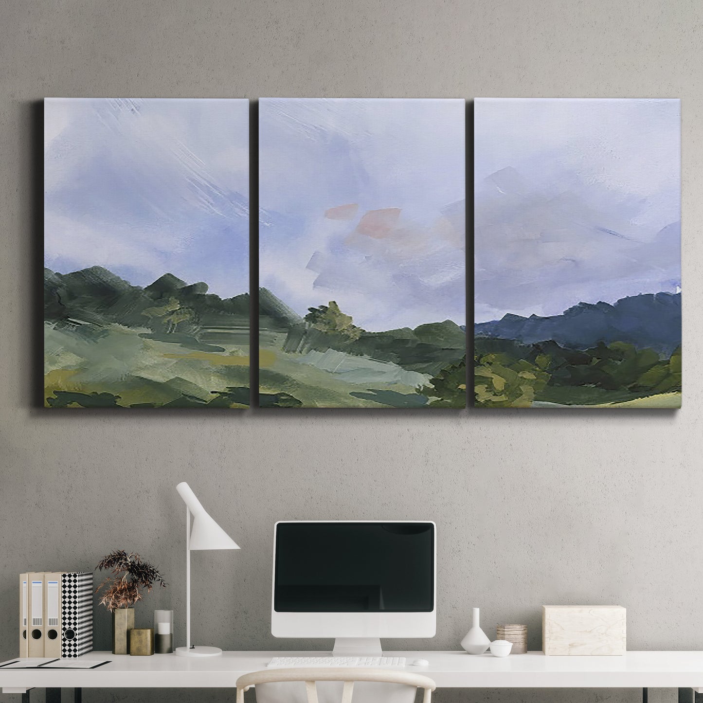 Three-panel canvas wall art featuring wide open pastoral horizon landscape, displayed above a desk in a home office.