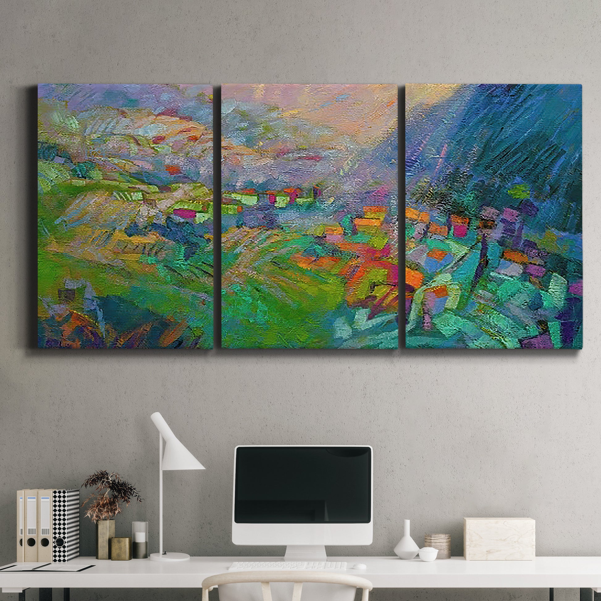 Three-panel canvas wall art featuring embracing landscape with warm tones, displayed above a desk in a home office.