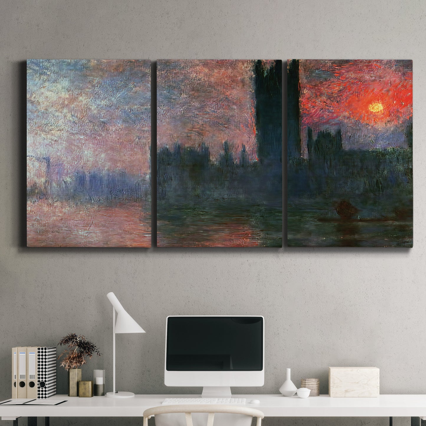 Three-panel canvas wall art featuring parliament silhouetted at dusk, displayed above a desk in a home office.
