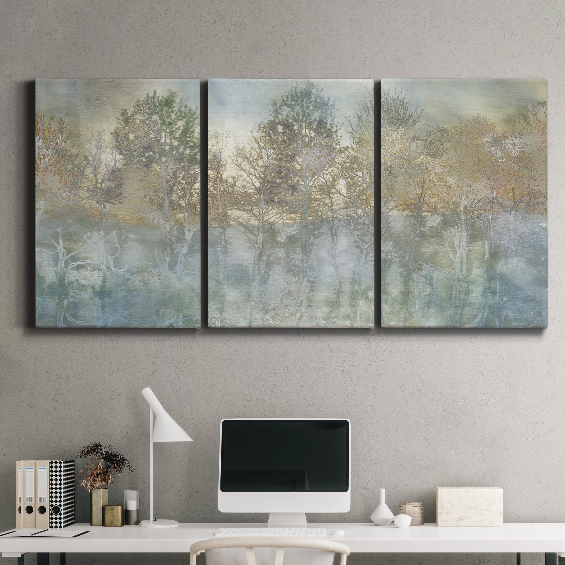Three-panel canvas wall art featuring abstract river reflections, displayed above a desk in a home office.