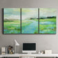 Three-panel canvas wall art featuring gentle stream winding through trees, displayed above a desk in a home office.