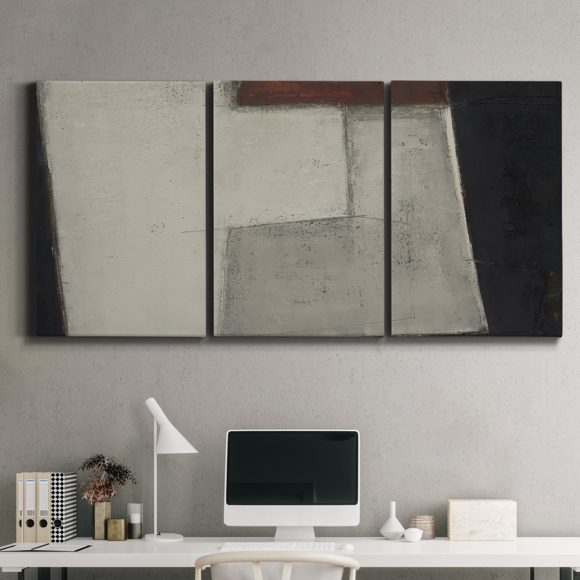 Three-panel canvas wall art featuring geometric abstract roadway motif, displayed above a desk in a home office.