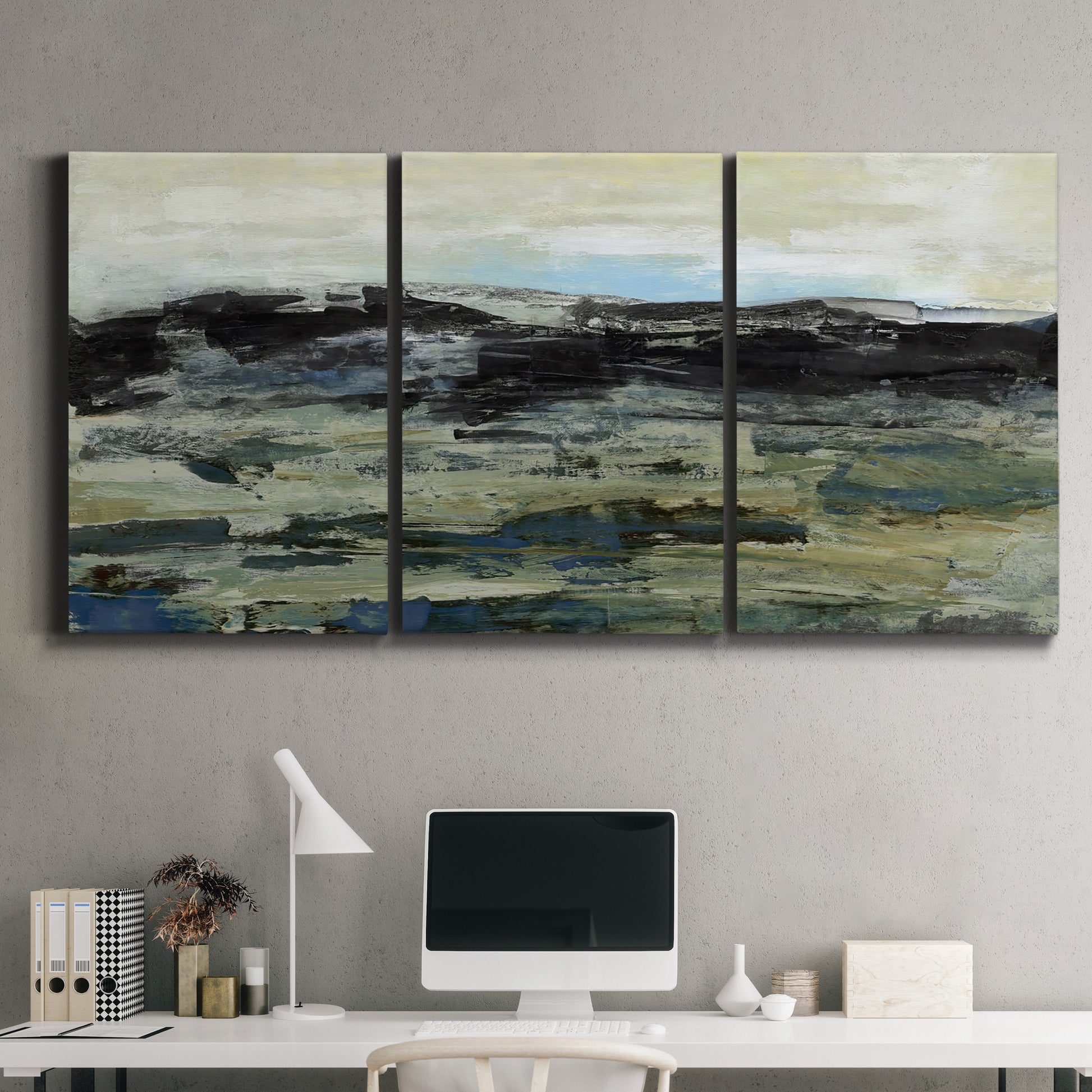 Three-panel canvas wall art featuring muted abstract landscape study, displayed above a desk in a home office.