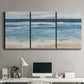 Three-panel canvas wall art featuring rolling ocean waves near shore, displayed above a desk in a home office.