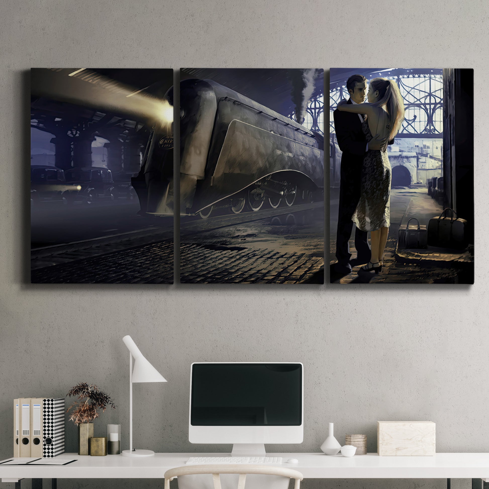 Three-panel canvas wall art featuring couple kissing at train station, displayed above a desk in a home office.