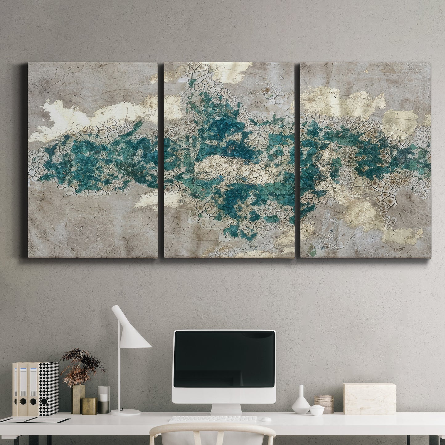 Three-panel canvas wall art featuring layered mineral abstract textures, displayed above a desk in a home office.