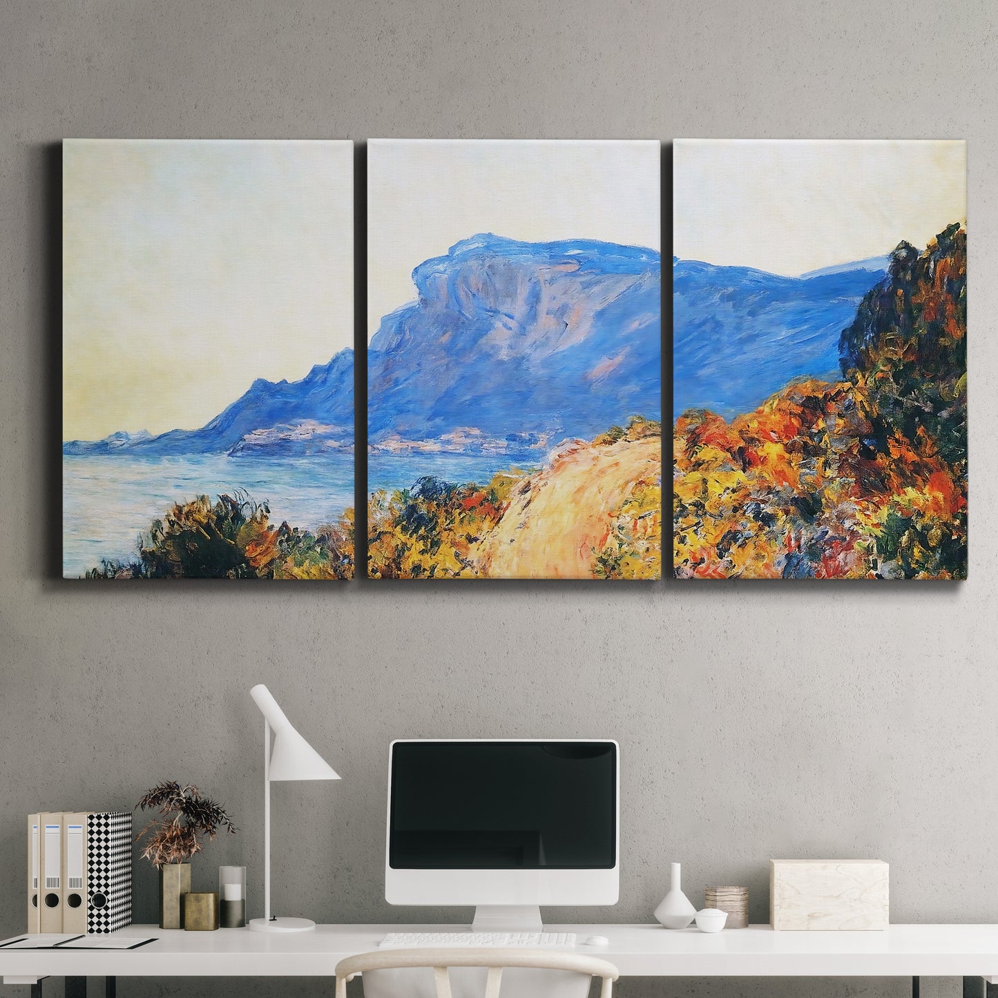 Three-panel canvas wall art featuring winding red road hillside, displayed above a desk in a home office.