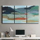Three-panel canvas wall art featuring vibrant abstract with dramatic motion, displayed above a desk in a home office.