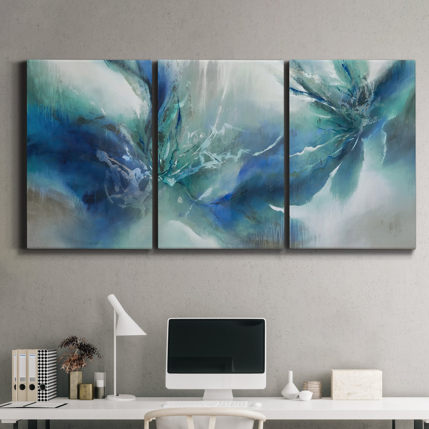 Three-panel canvas wall art featuring subtle abstract light flicker composition, displayed above a desk in a home office.
