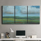 Three-panel canvas wall art featuring wide valley landscape with rolling hills, displayed above a desk in a home office.
