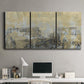 Three-panel canvas wall art featuring gold toned abstract horizon, displayed above a desk in a home office.