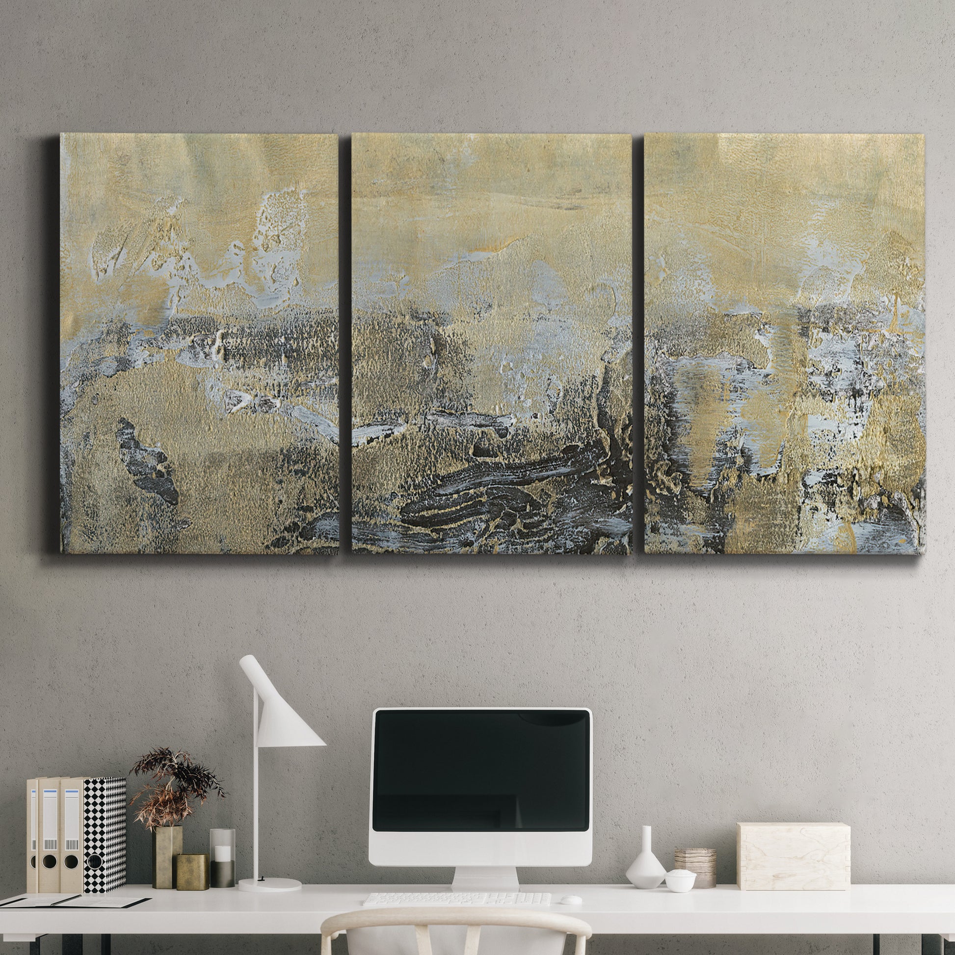 Three-panel canvas wall art featuring gold toned abstract horizon, displayed above a desk in a home office.