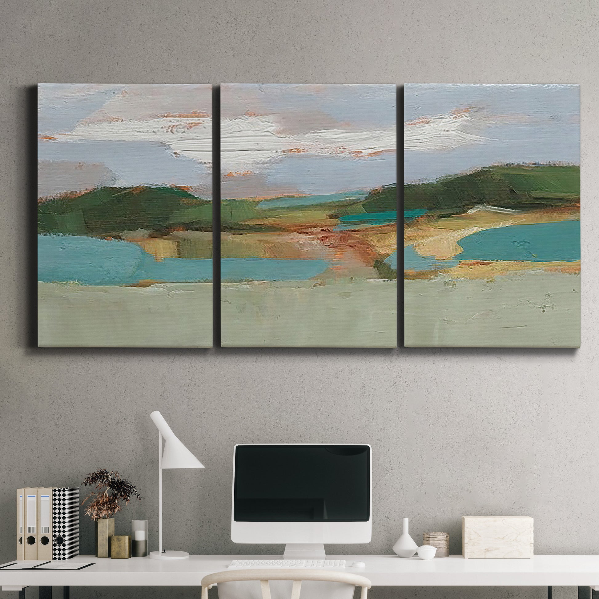 Three-panel canvas wall art featuring wide open landscape under midday light, displayed above a desk in a home office.