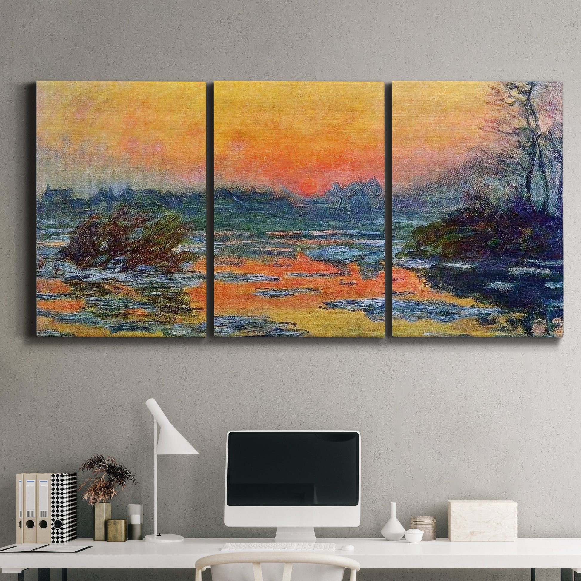 Three-panel canvas wall art featuring winter sunset over river, displayed above a desk in a home office.