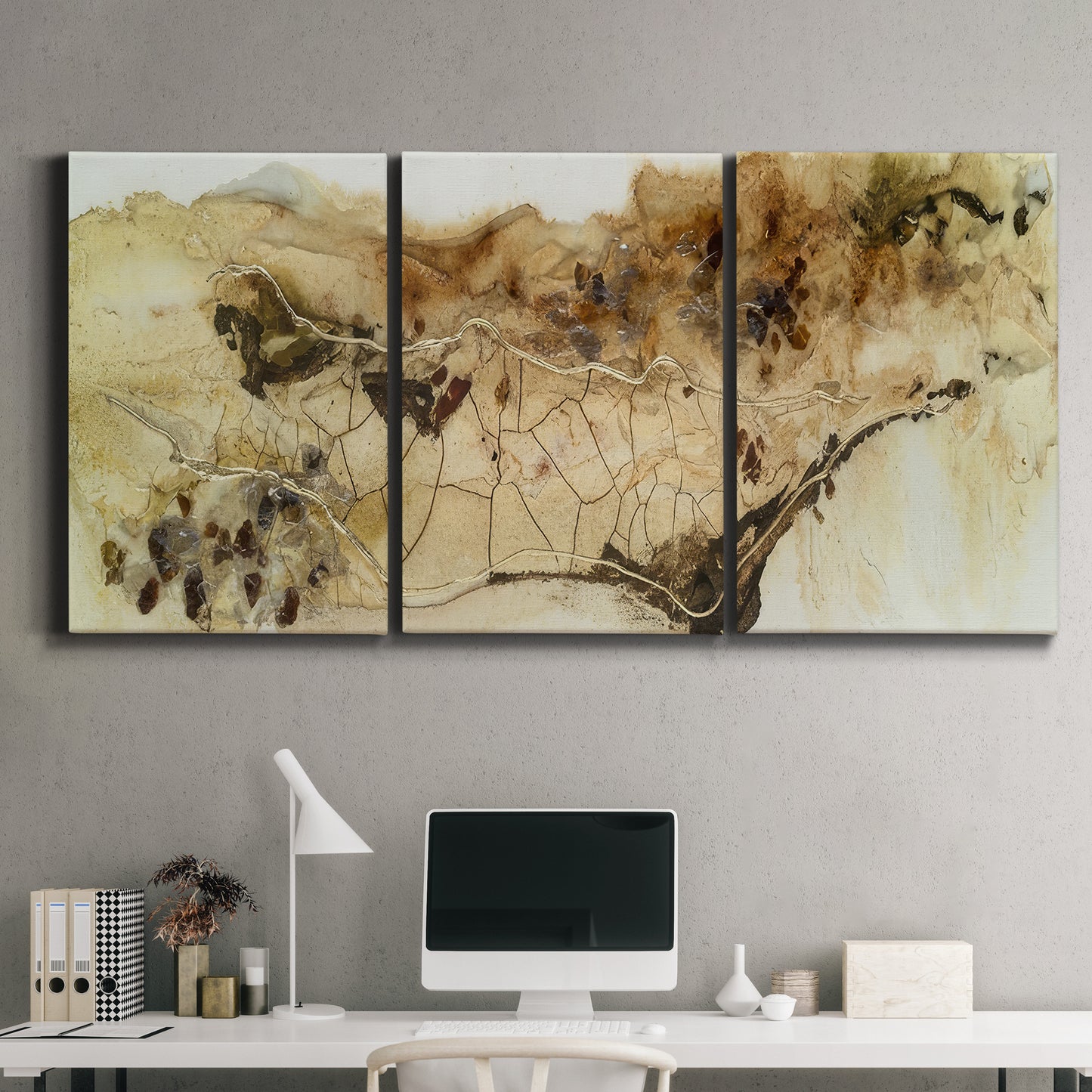 Three-panel canvas wall art featuring muted abstract with metallic gold accents, displayed above a desk in a home office.