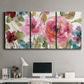 Three-panel canvas wall art featuring colorful floral watercolor composition, displayed above a desk in a home office.