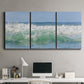 Three-panel canvas wall art featuring coastal waves breaking ashore, displayed above a desk in a home office.