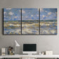 Three-panel canvas wall art featuring rough sea with crashing waves, displayed above a desk in a home office.